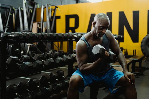 Man focusing before a workout session in a bright, clean space.